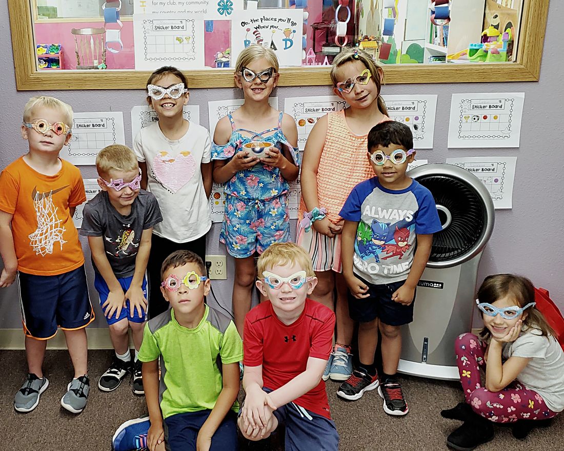 Children at a Webb Eyecare Champions for Sight vision screening, wearing screening glasses.