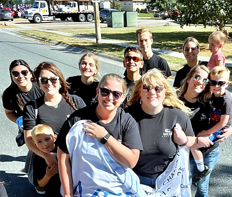 The Webb Eyecare team walking in a local parade.