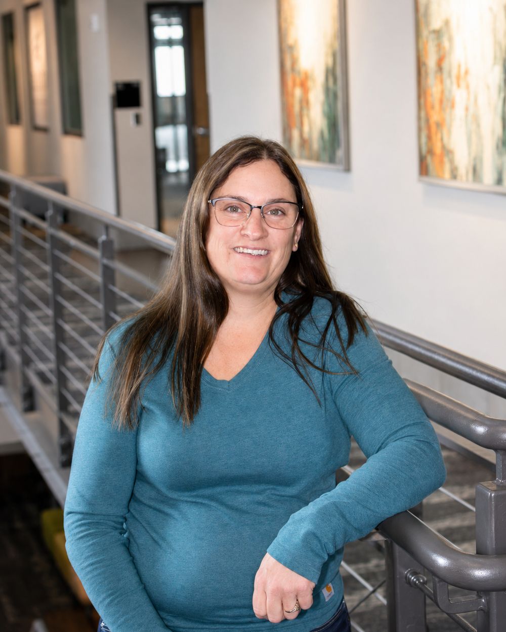 Webb team member modeling clear acetate frames.