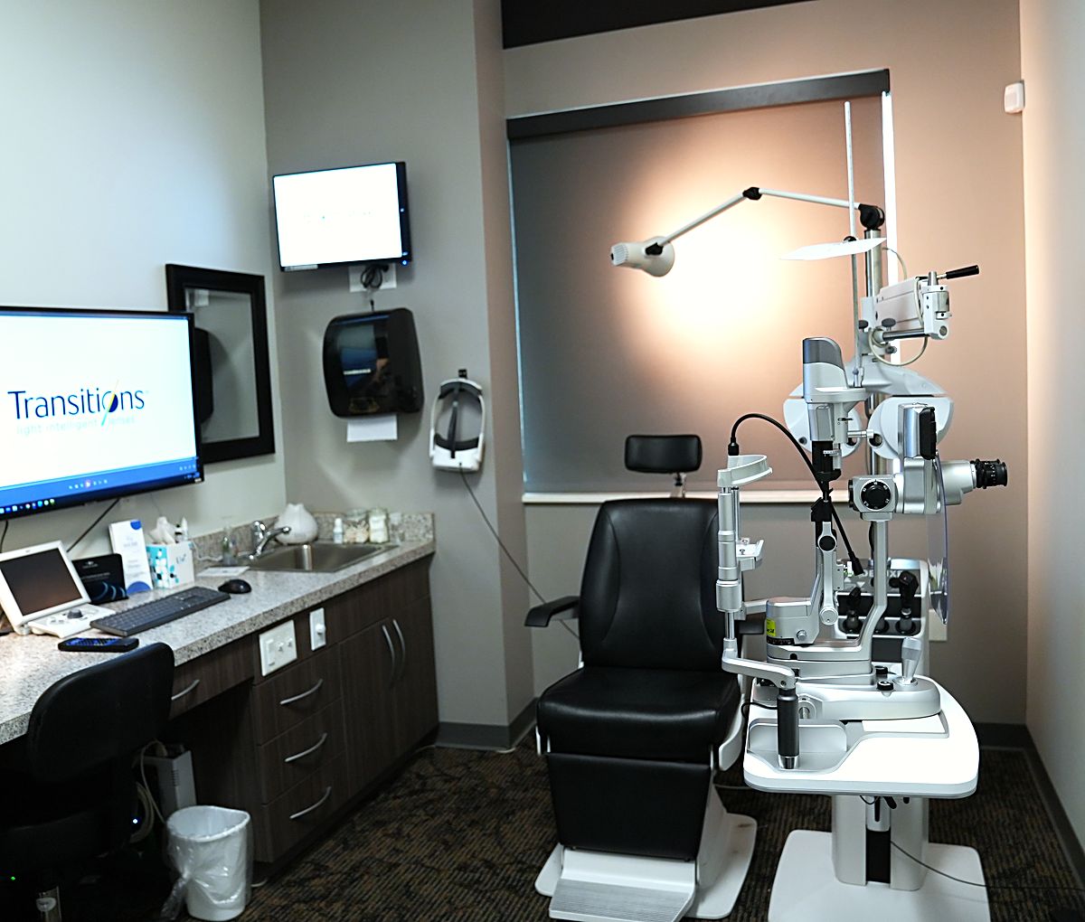 An exam room at Webb Eyecare in Scottsbluff, with the slit lamp and patient chair.