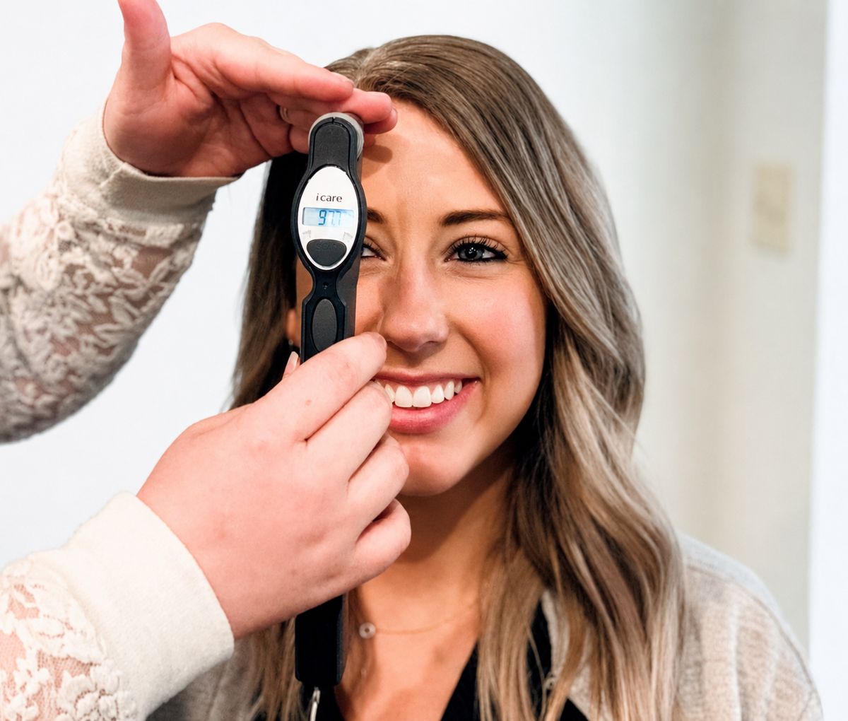 A Webb Eyecare doctor examining a patient during a first visit.